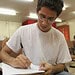 Felipe Lima, 19, preenche o formulário de inscrição