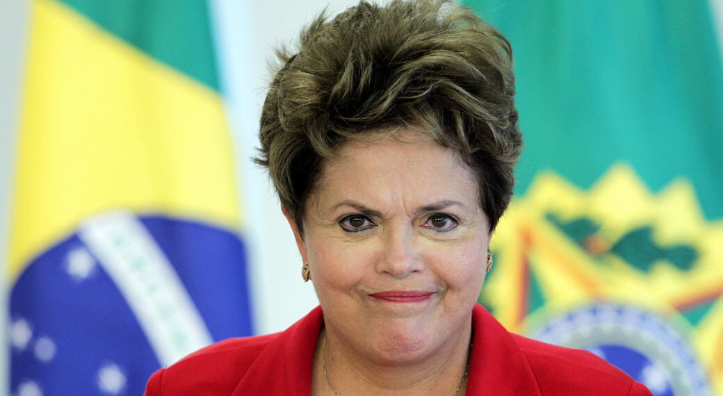 Brazil's President Dilma Rousseff attends a ceremony to sign the bill that creates the "Benefit of Overcoming Extreme Poverty in Early Childhood" in Brasilia October 3, 2012. The measure will guarantee minimum income of approximately $35 per capita for families with children up to six years. The benefit is the primary measure of Program Brasil Carinhoso. REUTERS/Ueslei Marcelino (BRAZIL - Tags: POLITICS BUSINESS SOCIETY HEADSHOT)