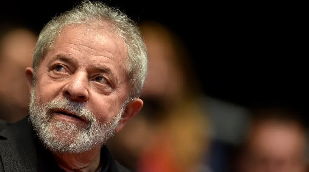 (FILES) This file photo taken on August 29, 2015 shows Brazilian former president (2003-2011) Luiz Inacio Lula Da Silva participating in the 12th Congress of the Brazilian Workers Union (CUT) in Belo Horizonte, Brazil, on August 28, 2015. 
Brazil police search home on March 4, 2016 of ex-president Lula da Silva in corruption probe.  / AFP / DOUGLAS MAGNO