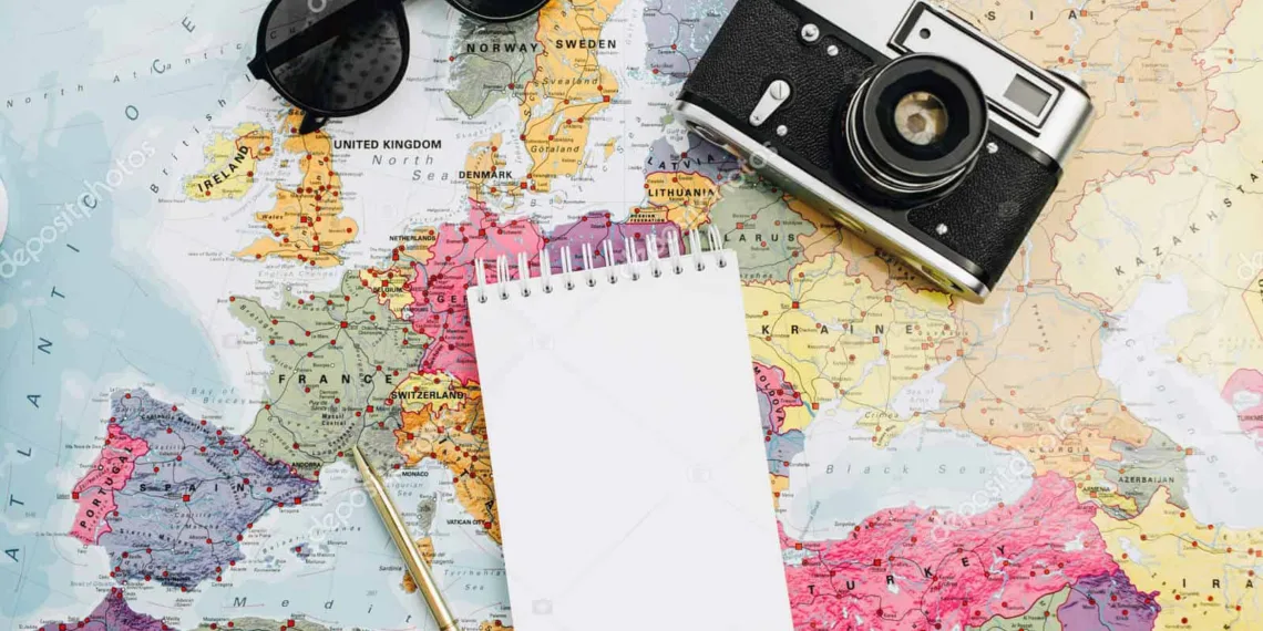 Travel notes mock up. World map, camera, sunglasses and notebook. Flat lay, top view.