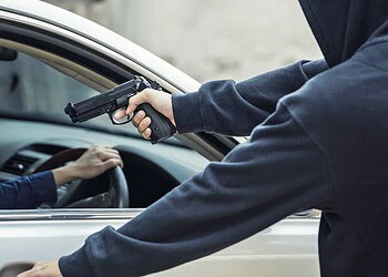 side view of car thief in action