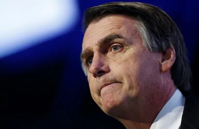 Federal deputy Jair Bolsonaro of the Party for Socialism and Liberation (PSL), a pre-candidate for Brazil's presidential election, attends a debate at the Industry Confederation event in Brasilia, Brazil July 4, 2018. REUTERS/Adriano Machado