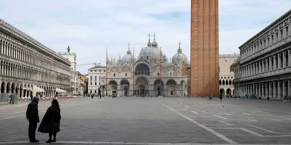 The almost empty St. Mark?s Square is seen after the Italian government imposed a virtual lockdown on the north of Italy including Venice to try to contain a coronavirus outbreak, in Venice, Italy, March 9, 2020. REUTERS/Manuel Silvestri