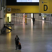 A flight attendant, wearing a protective face mask, walks at Guarulhos International Airport amid fears of coronavirus disease (COVID-19) in Guarulhos, Sao Paulo state, BraziI, April 1, 2020. REUTERS/Roosevelt Cassio