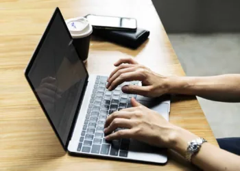 Woman using a laptop at work