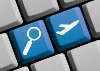 Search for flights online - symbols on computer keyboard