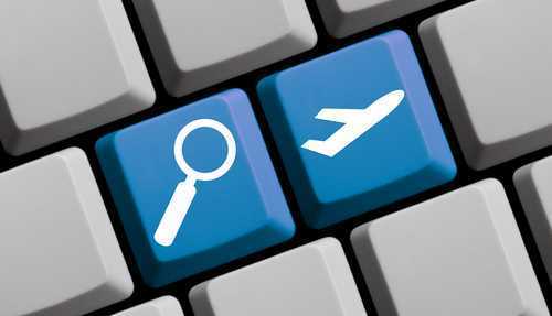Search for flights online - symbols on computer keyboard
