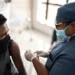 Teenager boy being vaccinated