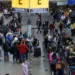 Passengers gather at Sao Paulo International Airport amid the outbreak of the coronavirus disease (COVID-19) and after Omicron has become the dominant coronavirus variant in the country, in Guarulhos, Brazil January 12, 2022.  REUTERS/Roosevelt Cassio